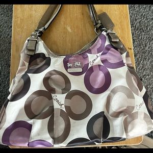 Coach purse. Some discoloration on bottom edges. 3 separate compartments